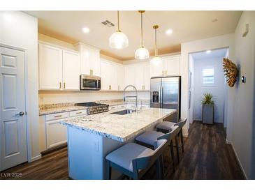 Modern kitchen with stainless steel appliances and granite countertops at 161 Petaluma Valley Dr, Las Vegas, NV 89138