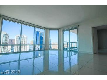 Bright living room with floor to ceiling windows and city views at 222 Karen Ave # 2601, Las Vegas, NV 89109