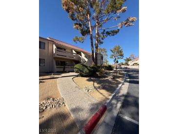 Building exterior with walkway and landscaping at 3761 Desert Marina Dr # 81, Laughlin, NV 89029