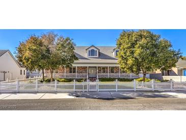 Beautiful two-story home with a large front yard and white picket fence at 5116 N Valadez St, Las Vegas, NV 89149