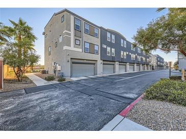 Modern townhome community with attached garages and landscaped grounds at 9050 W Tropicana Ave # 1075, Las Vegas, NV 89147