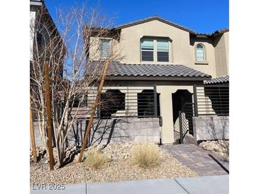 Two-story house with modern facade and landscaped front yard at 11751 Emerald Lake Ave, Las Vegas, NV 89138