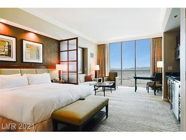 Spacious bedroom with city views and modern decor at 125 E Harmon Ave # 2816, Las Vegas, NV 89109