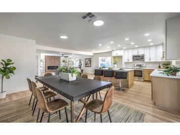 Modern kitchen with island, stainless steel appliances, and ample cabinetry at 2500 W Oakey Blvd, Las Vegas, NV 89102