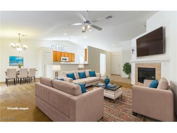 Virtually staged living room with fireplace and open floor plan at 3728 Discovery Creek Ave, North Las Vegas, NV 89031