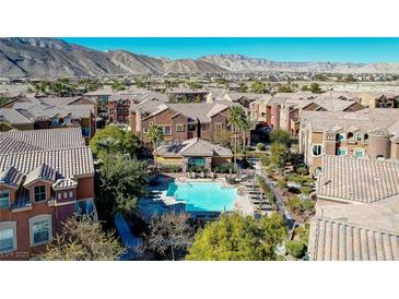 Aerial view of community pool and multiple residential buildings at 3975 N Hualapai Way # 293, Las Vegas, NV 89129