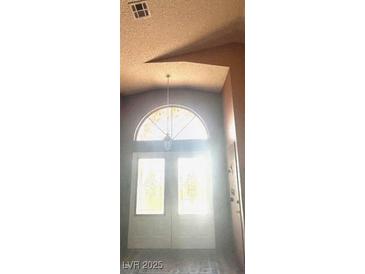 Bright entryway with arched window and double doors at 4856 Fiesta Lakes St, Las Vegas, NV 89130