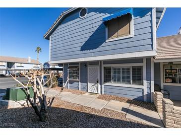 Light blue exterior of a condo building with walkway at 5340 Silvermist Ct # 103, Las Vegas, NV 89122