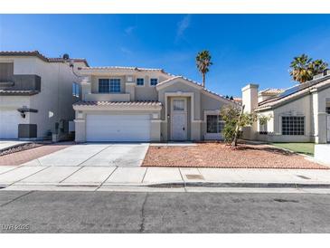 Charming two-story home featuring a well-maintained lawn, palm trees, and a two-car garage at 7233 Eaglegate St, Las Vegas, NV 89131