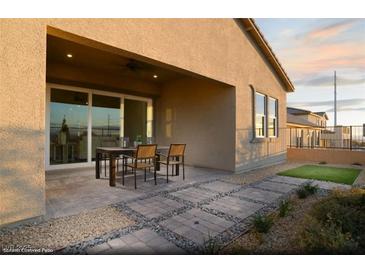 Relaxing covered patio with paver stones and seating area at 10929 Sage View Ave # Lot 205, Las Vegas, NV 89166