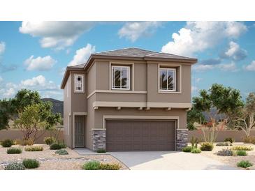 Two-story house with attached garage and desert landscaping at 630 Moonbeam Way, Mesquite, NV 89027