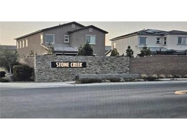 Stone Creek community entrance with two-story homes at 7050 Fossil Rim St, Las Vegas, NV 89084