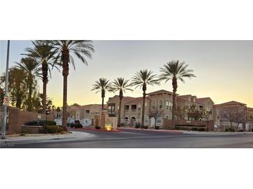 Attractive two-story building with palm trees and gated entrance at 9975 Peace Way # 2089, Las Vegas, NV 89147