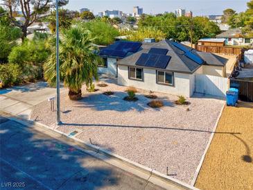 Aerial view of a remodeled house with solar panels and a spacious yard at 1411 Norman Ave, Las Vegas, NV 89104