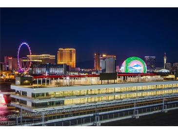 Night view overlooking Las Vegas skyline and race track at 205 E Harmon Ave # 1012, Las Vegas, NV 89169