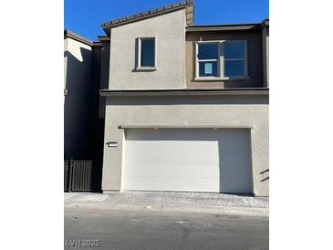 Modern two-story home with attached garage and neutral color scheme at 2532 Vandra St, Las Vegas, NV 89138