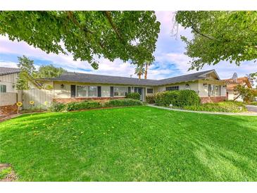 Ranch style home with a spacious lawn and mature trees at 2908 Bryant Ave, Las Vegas, NV 89102