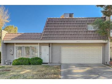 Two-story house with attached garage and manicured lawn at 3642 Haverhill St, Las Vegas, NV 89121