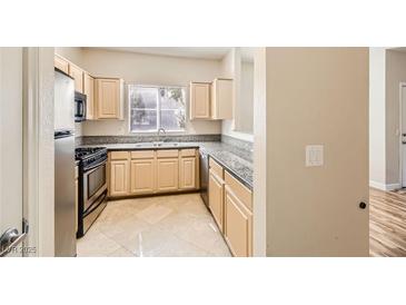 Bright kitchen with stainless steel appliances and granite countertops at 5250 S Rainbow Blvd # 2056, Las Vegas, NV 89118