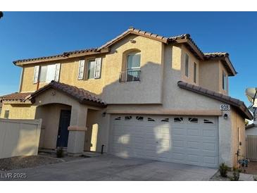 Two-story house with attached garage and neutral color scheme at 938 Cantabria Heights Ave, Las Vegas, NV 89183