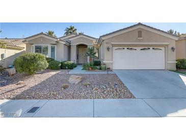 One-story house with a two-car garage and landscaped front yard at 10247 Santo Nina Ct, Las Vegas, NV 89135