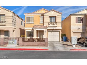 Charming two-story home with desert landscaping, covered porch, and attached garage at 10452 Prairie Schooner Ave, Las Vegas, NV 89129