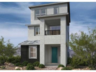 Contemporary three-story home with teal door and balcony at 1521 Bat Hawk St, Las Vegas, NV 89144