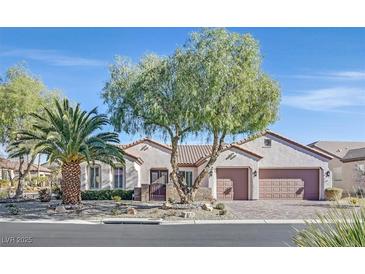 Single-story home with desert landscaping and two-car garage at 2050 Cambridge Springs Dr, Henderson, NV 89052