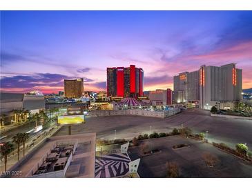 Aerial view of city skyline at sunset with distant casinos visible at 2700 Las Vegas Blvd # 809, Las Vegas, NV 89109