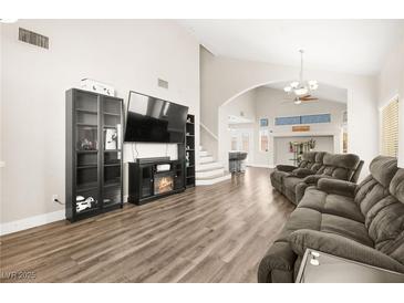 Spacious living room featuring hardwood floors and a fireplace at 6227 Legend Falls St, North Las Vegas, NV 89081