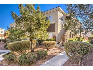 Well-maintained two-story building with landscaping and walkway at 9303 Gilcrease Ave # 2177, Las Vegas, NV 89149