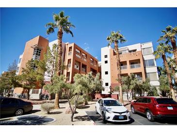Modern condos featuring balconies, desert landscaping and ample parking at 23 E Agate Ave # 506, Las Vegas, NV 89123