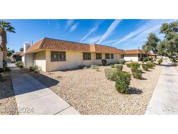 Single story home with landscaped yard and walkway at 2764 Heritage Ct, Las Vegas, NV 89121