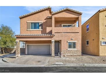 Two-story house with attached garage and front yard landscaping at 1992 Star Creek Bay Ln, Las Vegas, NV 89115