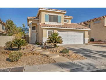 Two-story house with landscaped yard, two-car garage, and neutral color scheme at 716 Amber Hills Dr, Las Vegas, NV 89123