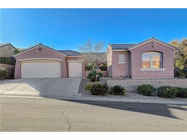 Single-story house with a two-car garage and landscaped front yard at 2039 Colvin Run Dr, Henderson, NV 89052