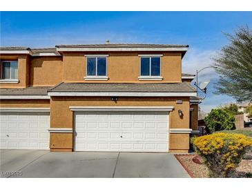 Two-story home with a two-car garage and desert landscaping at 3349 Morning Amber St, North Las Vegas, NV 89032