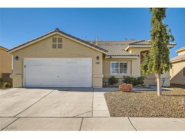 Single-story house with a two-car garage and landscaped front yard at 3709 Ferrell St, North Las Vegas, NV 89032