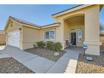 Charming single story home featuring a well-maintained yard and covered entryway at 3709 Ferrell St, North Las Vegas, NV 89032