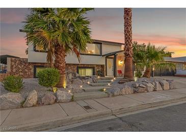 Stunning curb appeal with mature landscaping and a welcoming entrance at 4361 Verona Ave, Las Vegas, NV 89120