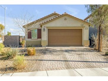 Charming single-story home with a well-maintained front yard and neutral color palette at 6318 Amber Sunrise St, North Las Vegas, NV 89031