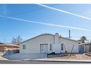 Single story home with front yard and driveway at 6229 Cromwell Ave, Las Vegas, NV 89107