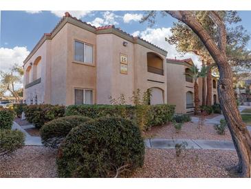 Tan two-story building with trees and landscaping at 7885 W Flamingo Rd # 1092, Las Vegas, NV 89147