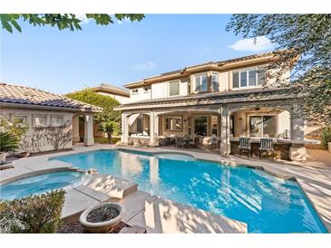 Inviting backyard pool and spa with covered patio, seating, and outdoor bar area at 5455 San Florentine Ave, Las Vegas, NV 89141