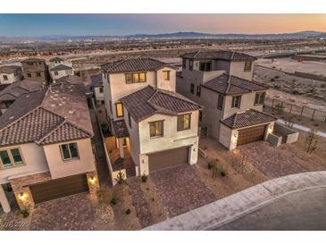 Aerial view of modern homes with mountain views at 2376 Switchback Valley St, Las Vegas, NV 89138