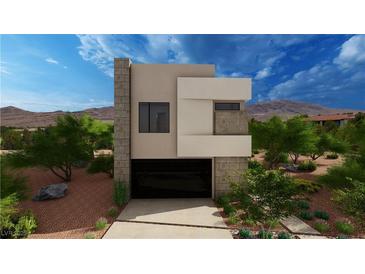 Modern two-story home with attached garage and desert landscaping at 3979 Heron Fairway Dr, Las Vegas, NV 89141