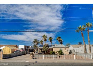 Charming single-story home with desert landscaping, solar panels, and palm trees at 132 Continental Ave, Henderson, NV 89015