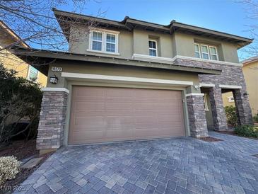 Two-story house with stone accents and a two-car garage at 10273 Aragon Crown Rd, Las Vegas, NV 89135