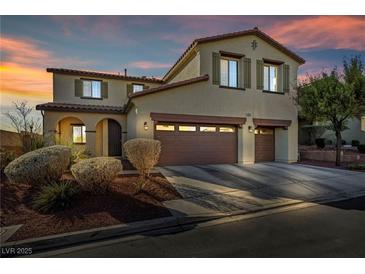 Two-story house with two-car garage, landscaping, and a charming facade at 10611 Auburn Springs Ave, Las Vegas, NV 89166