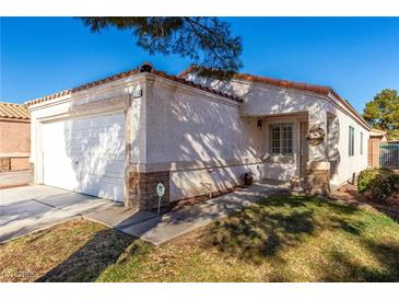 One-story house with attached garage and well-maintained lawn at 2204 Kendall Hill Ave, Las Vegas, NV 89106